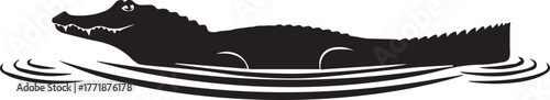Black silhouette of an alligator swimming in rippling water wildlife scene