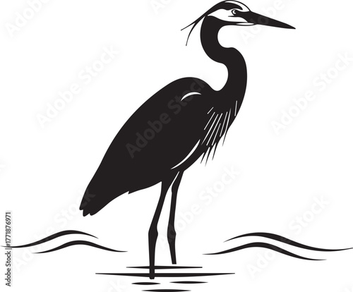 Majestic great blue heron silhouette standing in water calmly and elegantly