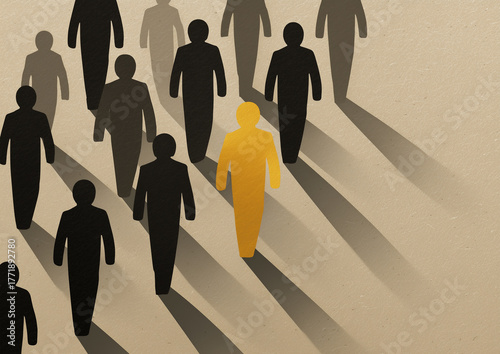 Concept of leadership individuality and uniqueness shown by golden person standing out among black crowd with long shadows