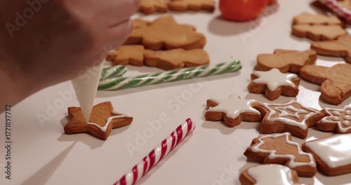 Get ready for Christmas by making delicious gingerbread cookies from scratch. Watch as festive shapes are decorated with colorful icing and sprinkles, perfect for holiday sharing.