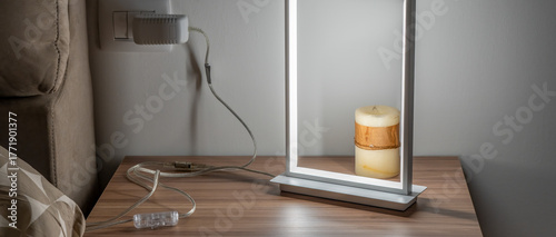 Bild auf Leinwand Contemporary LED lamp casting soft light on a nightstand