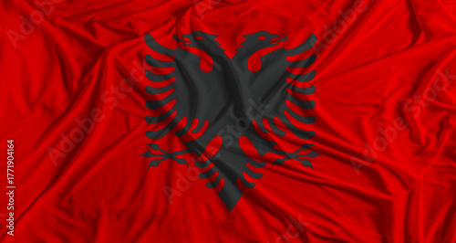 Foto Albanian flag with fabric texture background
