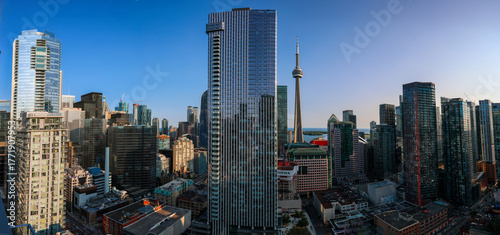 Panoramic view of downtown Toronto, Ontario Canada cityscape. Bustling city life with modern skyscrapers and water in the background. 