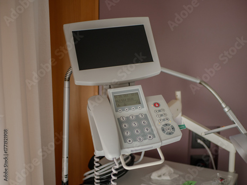 Modern hospital diagnostic and communication device for patient monitoring and healthcare technology in a clean clinical room, pro photo. High quality photo