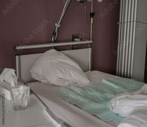 Empty bed in clinical quarantine ward during contagious virus outbreak. Biohazard isolation room for lethal epidemic like Ebola or Hantavirus
