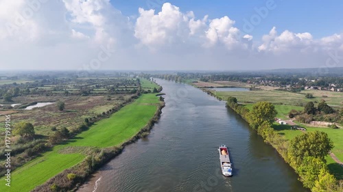 Aerial view of a barge sailing on the elbe river in saxony-anhalt, germany