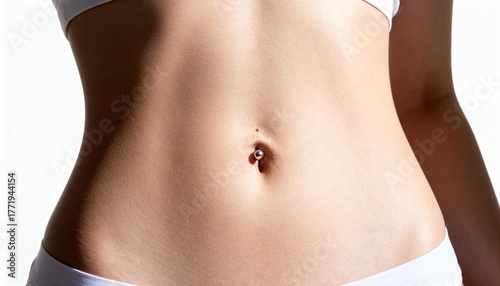 Minimalist close-up of a young woman’s waist with navel piercing in bright studio light.