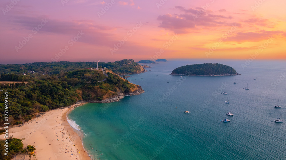 Fototapeta premium Stunning sunset at Nai Harn Beach scenic views from phuket, thailand