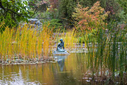 Canvas Print Bronze statue of a sitting girl or nymph in the Japanese Garden on Margit-sziget