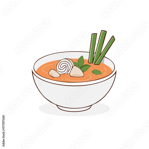 Bowl of Spicy Orange Soup with Noodles and Greens