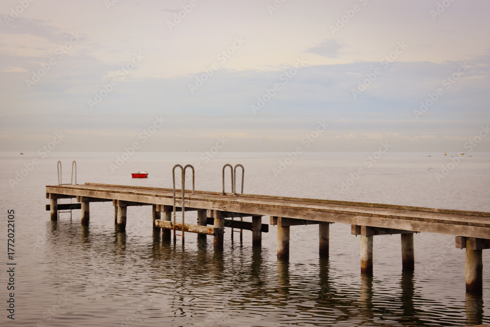 Obraz premium view of old pier at sunset