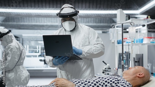 Photos Medic in protective coveralls and gloves treats a patient in quarantine, analyzing infection data and testing vaccines to prevent outbreak spread and improve healthcare crisis