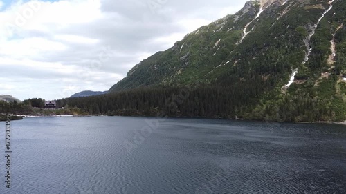 Aerial view of Morskie Oko Lake in Tatra Mountains, Zakopane, Poland. Crystal-clear mountain lake, rocky mountains and ancient forest. Wild nature in Poland. National park Zakopane, Poland.