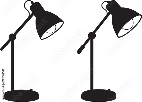 Two black desk lamps in silhouette against white background
