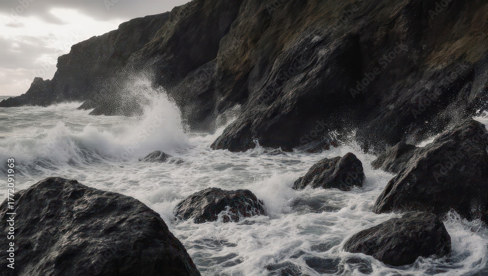Obraz premium Dramatic coastal scene shows waves crashing against a rocky cliff under a stormy sky