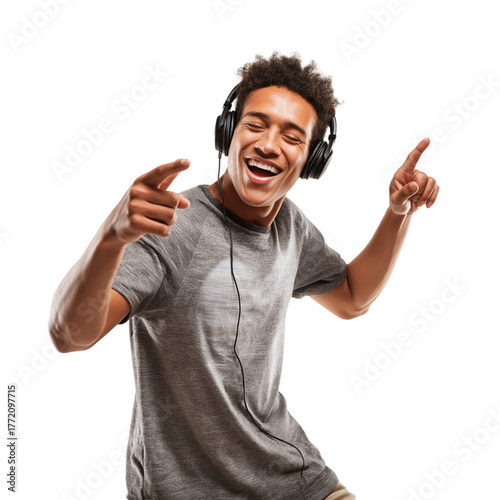 Smiling Young Man Dancing with Headphones, Pointing Up, Isolated on White Background 