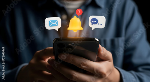 Stay connected and informed with instant notifications, alerts, and messages appearing above a modern smartphone held by hands, symbolizing digital communication and engagement.