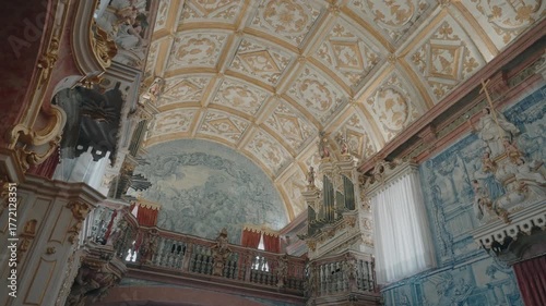 golden baroque ceiling, organ, and blue tile art inside Nossa Senhora do Porto de Ave Sanctuary in Taíde, Portugal