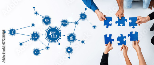 This image depicts a collaborative environment with hands grasping puzzle pieces, symbolizing teamwork and connection, alongside graphic representations of communication and strategy. Amity