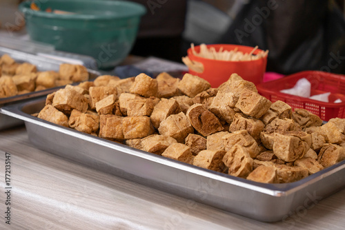 Chou tofu (stinky tofu) is a traditional Chinese fermented tofu known for its strong, pungent odor and unique flavor. Stinky tofu is often served with pickled cabbage, chili sauce or soy based sauce.