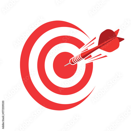 Red dart flying towards the bullseye on a target