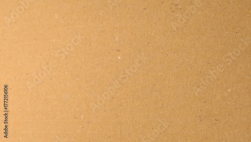 Background of brown kraft paper or cardboard texture. Abstract pattern of beige rough carton, old paper sheet.