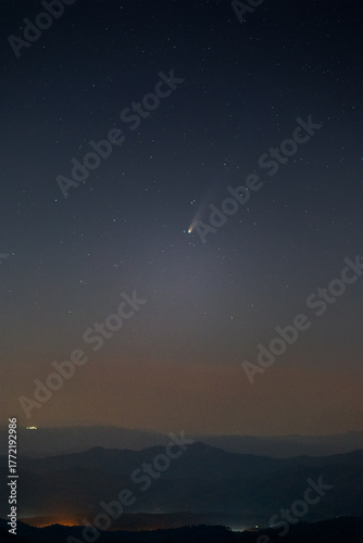 comet c/2025 a6 (lemmon) glowing in the pre-dawn sky above mountain ridges on october 29, 2025, when the comet reached perihelion, its closest approach to the sun.