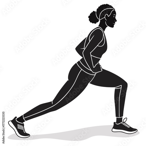 Silhouette of a fit athletic woman performing a deep lunge exercise in athletic wear with her hands on her hips demonstrating strength and flexibility