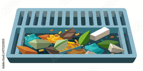 Debris in drainage grate with assorted colorful stones and leaves  