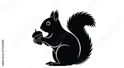 Silhouette of a squirrel holding an acorn vector illustration of a cute animal with a nut in its paws