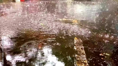 Heavy Rain on Asphalt Road During Rainy Season