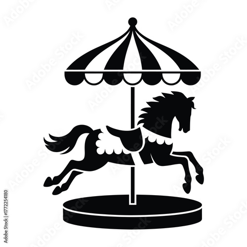 Silhouette of a carousel horse under a striped umbrella