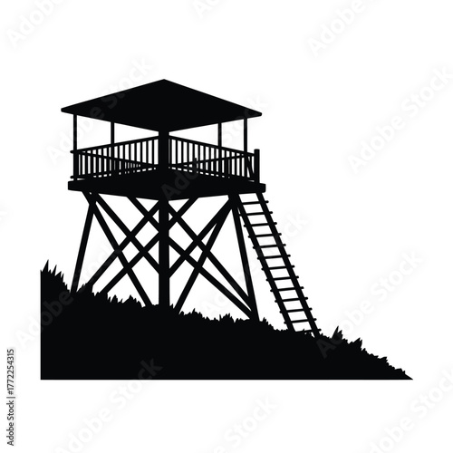 Silhouette of a wooden observation tower on a grassy hill