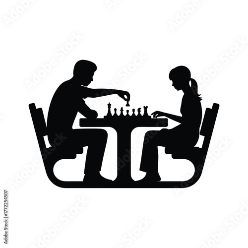 Silhouettes of a man and woman playing chess at a table