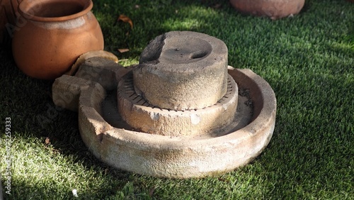 Old millstone or grindstone. Vintage.