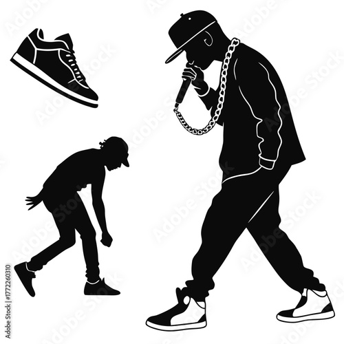 Silhouette of rapper with microphone and breakdancer