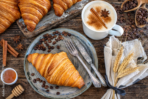 Fresh French croissants in the plate. 
