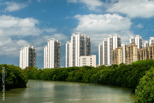 new residential quarter with typical skyscraper buildings among greenery in Santa. Tourism development of Sanya, Hainan island, China