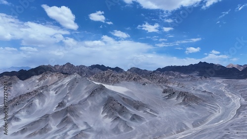Black Mountain desert mountain landscape,Black Mountain peaks under blue sky,Majestic and desolate scenery of Black Mountain,Black Mountain scenery on the western plateau,Black mountains with blue sky
