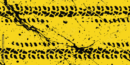 Grungy yellow background with black tire tracks and ink or mud splatters, creating an abstract texture.