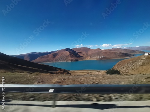 Natural landscape along a mountain road on the plateau,Blue lake and mountains along a plateau road