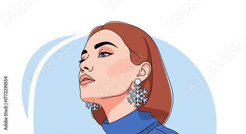 Elegant woman portrait wearing snowflake earrings and stylish blue outfit