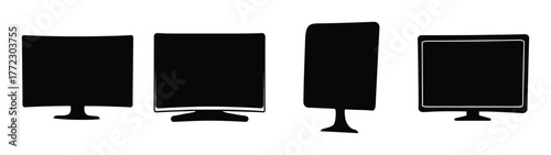Four different black computer monitors and televisions displayed in a row on a