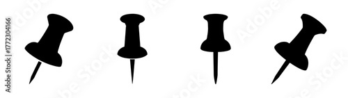 Four black push pins isolated on white background