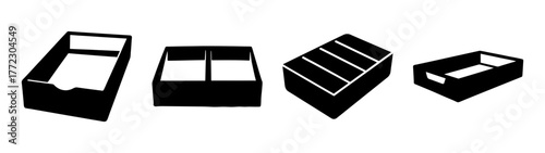 Collection of four black plastic trays or organizers, isolated on white background