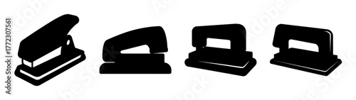 Collection of four black office staplers and hole punchers in silhouette, isolated on a white background