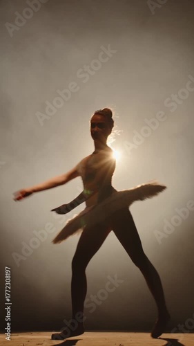 Wallpaper Mural Ballet Dancer Moving Gracefully Under Golden Spotlight Expressing Balance Mindfulness and Confidence in Artistic Feminine Performance Torontodigital.ca
