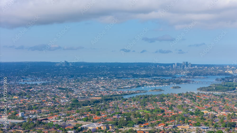 Naklejka premium Panorama aerial drone view of western Sydney Suburbs of Canterbury Burwood Ashfield Marrickville Campsie with Houses roads and parks in Sydney New South Wales NSW Australia