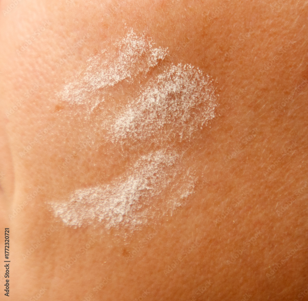 Fototapeta premium Flour on human skin as a background. Close-up.