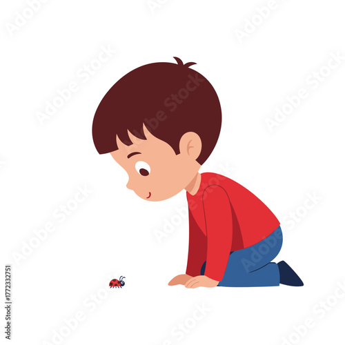 A young boy on his knees is curiously observing a small ladybug on the ground.